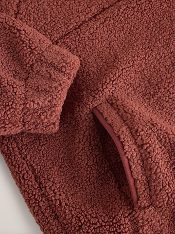 Pull-over self. en marron