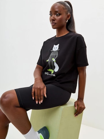 T-shirt 'Sport Cat with Dumbbells' Cat e Lolette en noir