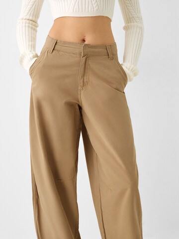 Bershka Loose fit Chino trousers in Beige