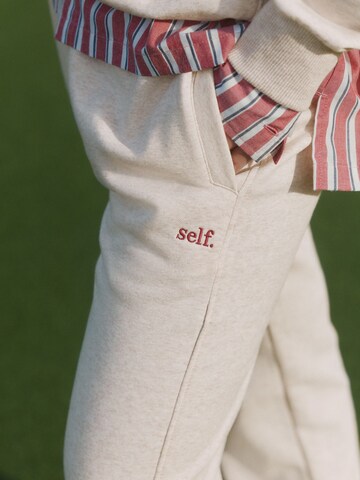 self. Tapered Broek in Beige