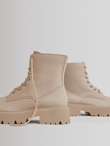 Bershka Lace-up bootie in Beige