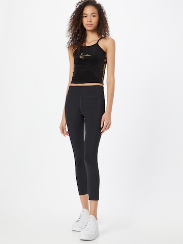 Skinny Pantaloni sport de la Girlfriend Collective pe negru