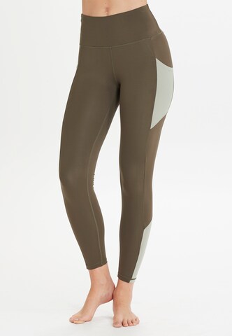 Athlecia Skinny Workout Pants 'Sasha' in Green: front