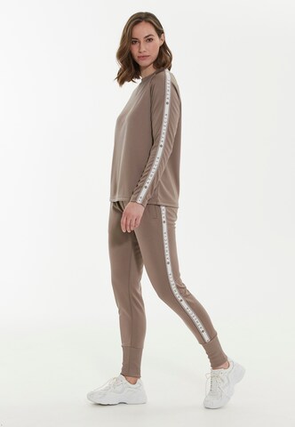 Athlecia Slim fit Workout Pants 'Sella' in Brown