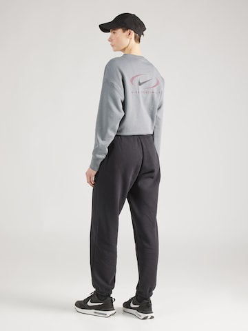 Nike Sportswear Дънки Tapered Leg Панталон в черно