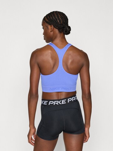 NIKE Sporttop in Lila