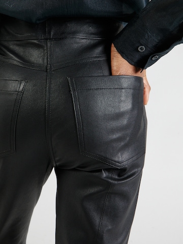 REMAIN Regular Pants in Black