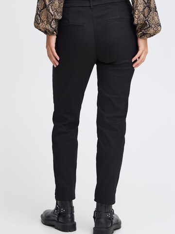 Skinny Pantaloni chino di PULZ Jeans in nero
