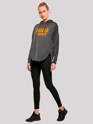 F4NT4STIC Sweatshirt 'Stranger Things Fire Logo Women Netflix TV Series' in Grey