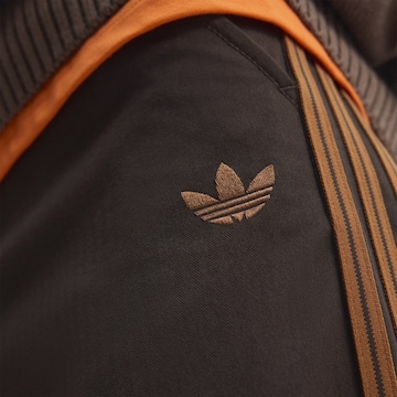 ruda ADIDAS ORIGINALS Standartinis Kelnės 'Firebird'