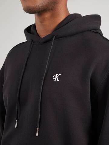 Felpa 'MONOGRAM' di Calvin Klein Jeans in nero