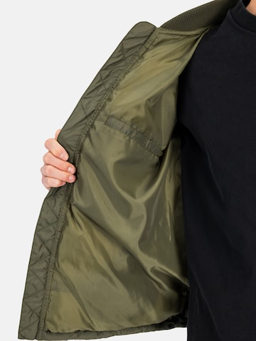 ALPHA INDUSTRIES Winter Jacket 'MA-1' in Green