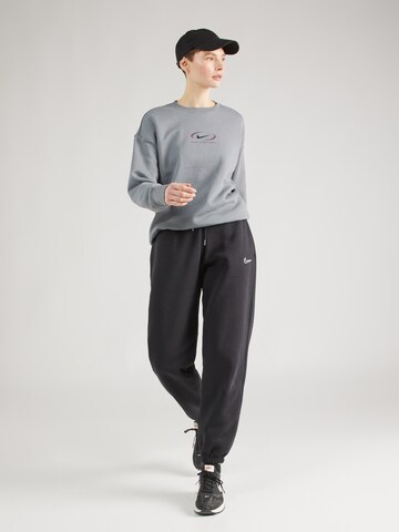 Nike Sportswear Дънки Tapered Leg Панталон в черно