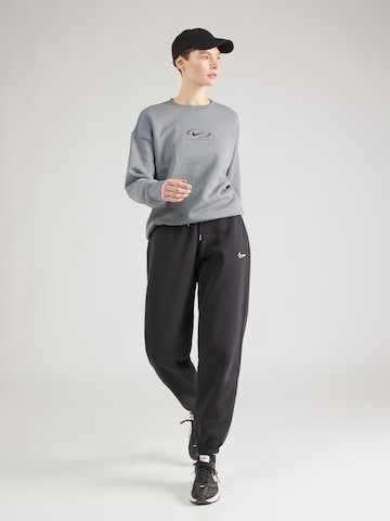 juoda Nike Sportswear Siaurėjantis Kelnės