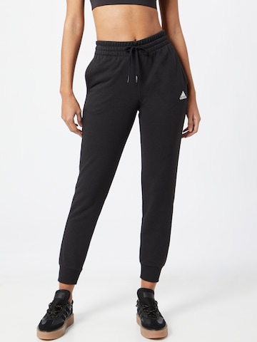 Loosefit Pantalon de sport 'Essentials French Terry Logo' ADIDAS SPORTSWEAR en noir : devant