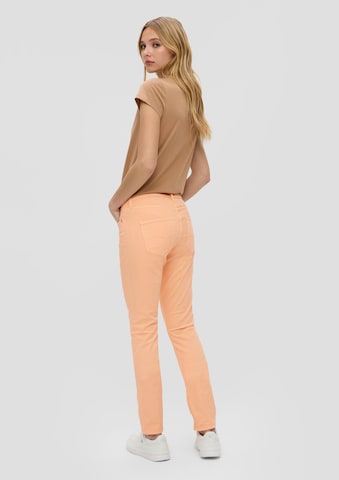 Coupe slim Jean QS en orange : derrière