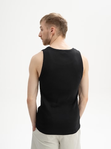 MELA T-shirt 'CHETAN' i svart