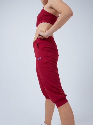 SPORTKIND Loosefit Sporthose 'Caprihose mit Taschen'‌‌‌‌‌ in Rot
