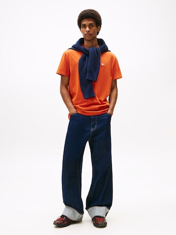 Tricou de la Tommy Jeans pe portocaliu