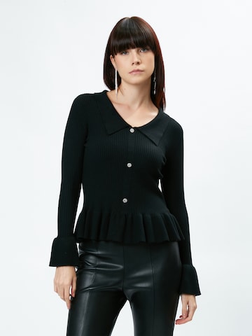 Pullover 'Peplum ' di Influencer in nero: frontale
