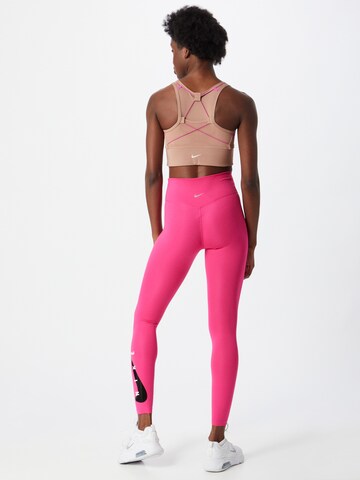 NIKE Skinny Spodnie sportowe w kolorze różowy