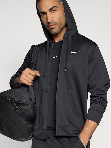 NIKE Urheilullinen collegetakki 'FLEX' värissä musta