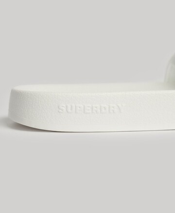 Claquettes / Tongs Superdry en blanc