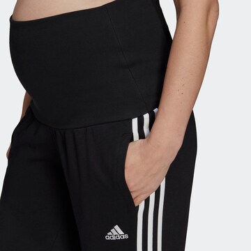 ADIDAS SPORTSWEAR Tapered Urheiluhousut 'Essentials  3-Stripes ' värissä musta