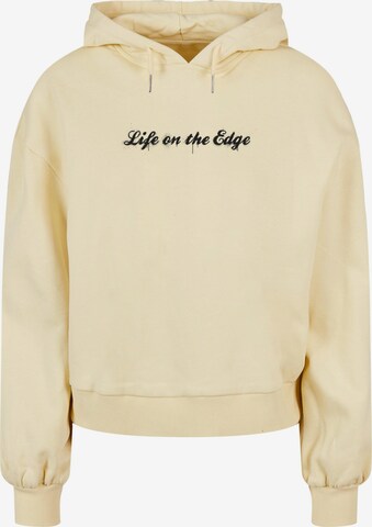 Merchcode Sweatshirt 'Peanuts - Life on the edge' in Gelb: predná strana