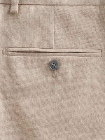 Next Tapered Suorat housut värissä harmaa