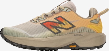 Chaussure de course 'Rebel Trail' new balance en marron : devant