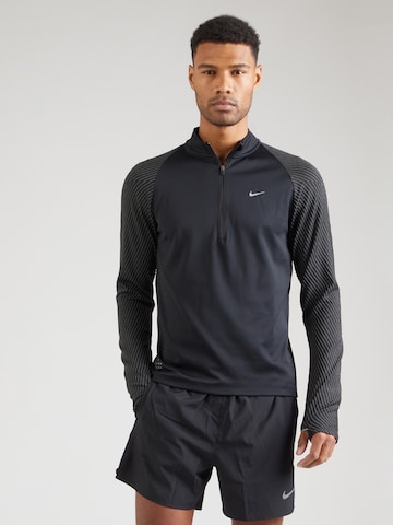 NIKE Athletic Sweatshirt 'Running Division' in Black: front