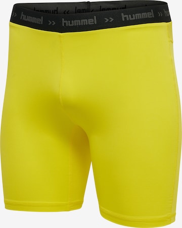 Hummel - Skinny Pantalón deportivo en amarillo
