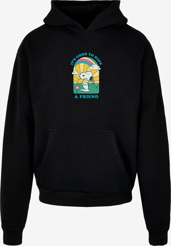 Merchcode Sweatshirt 'Peanuts - It's Good To Have A Friend' in Schwarz: predná strana