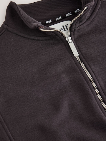 self. - Sudadera en marrón