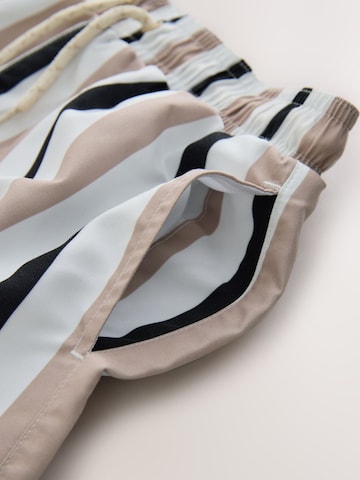 Next Plavecké šortky – béžová