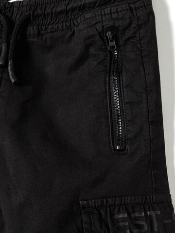 Effilé Pantalon MINOTI en noir