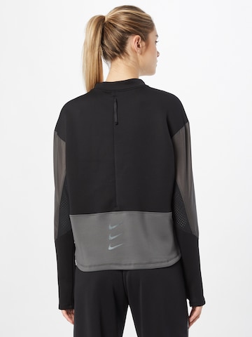 NIKE Sportsweatshirt 'Run Divsion' in Schwarz