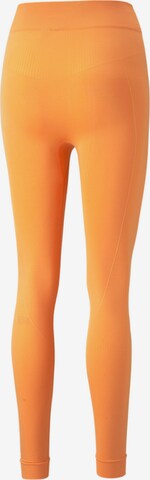 PUMA Skinny Urheiluhousut 'STUDIO FOUNDATIONS' värissä oranssi