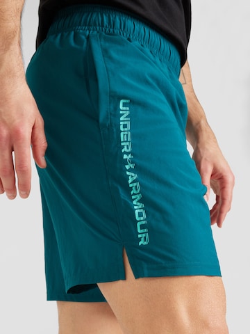 Regular Pantalon de sport 'Gewebte Wdmk' UNDER ARMOUR en vert