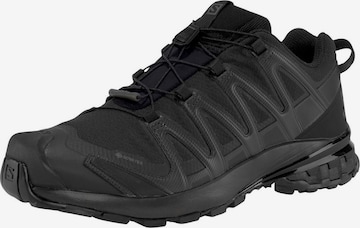 SALOMON Running Shoes in Black: front