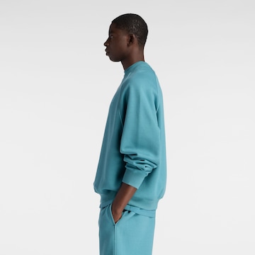 Sweat-shirt 'Trackside' new balance en bleu