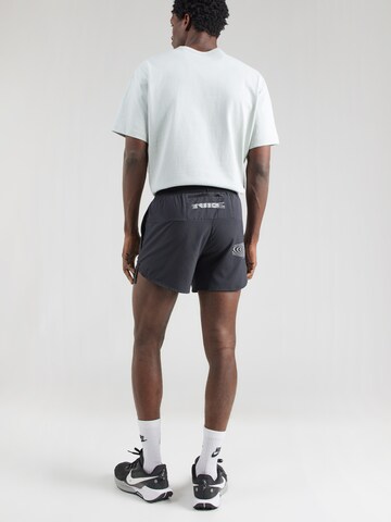 NIKE Regular Workout Pants 'STRIDE ENERGY' in Black