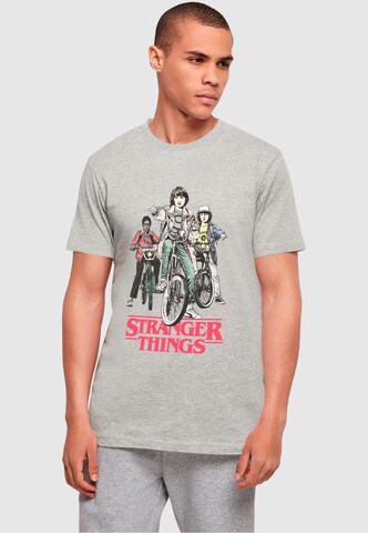 ABSOLUTE CULT T-Shirt 'Stranger Things - Retro Bikers' in Grau: Vorderseite