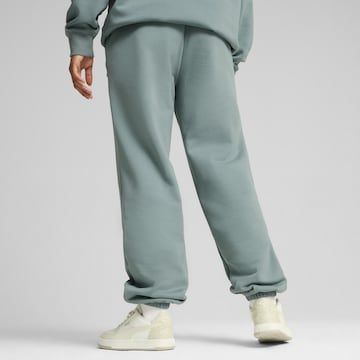 PUMA Tapered Sporthose in Grün