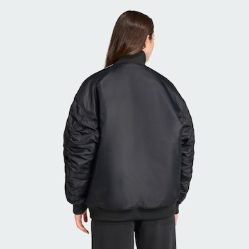 ADIDAS ORIGINALS Between-season jacket 'Firebird' in Black