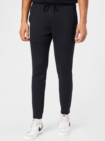 Effilé Pantalon de sport new balance en noir : devant