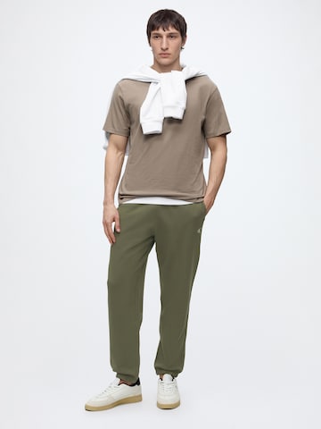 Calvin Klein Jeans Tapered Hose in Grün