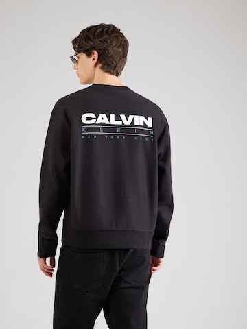 Calvin Klein JeansSweater majica - crna boja: prednji dio