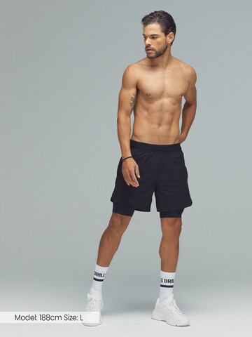 DRILLS Apparel Regular Sports trousers 'XFUNCTION 2-in-1 Shorts' in Black